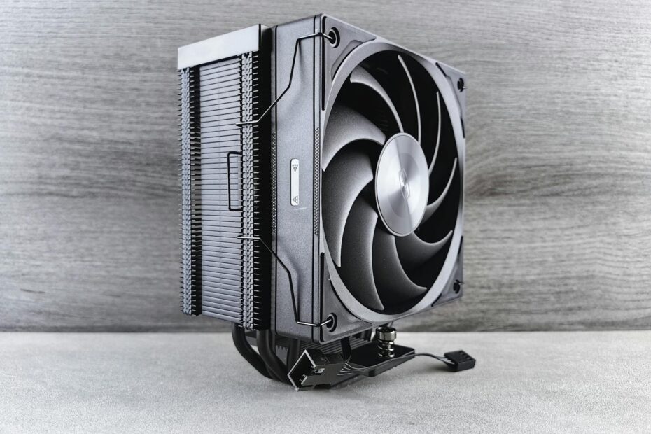 A sleek and modern black CPU cooling fan against a neutral gray backdrop.