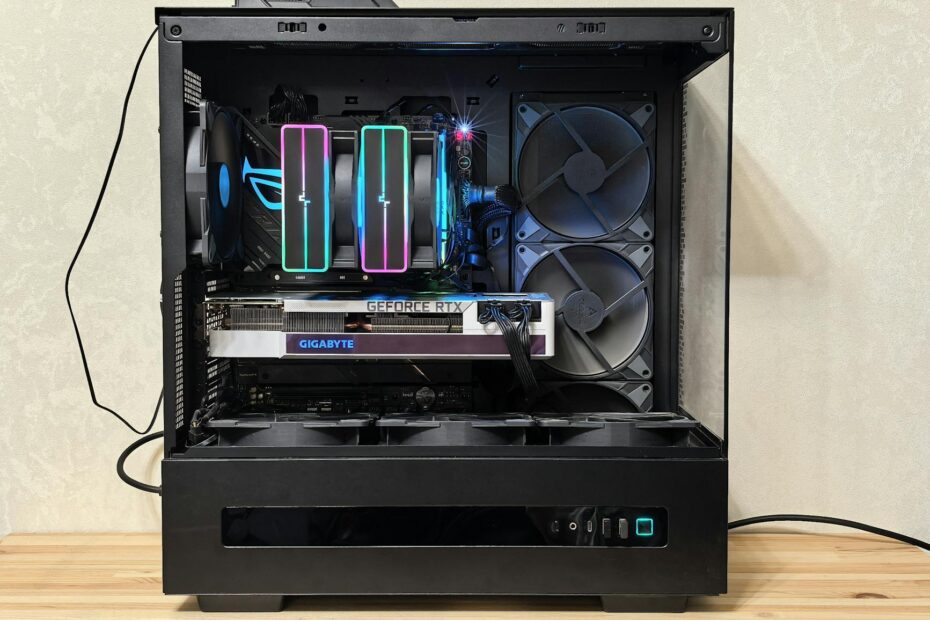 Close-up of a gaming PC with RGB lights and advanced cooling system.