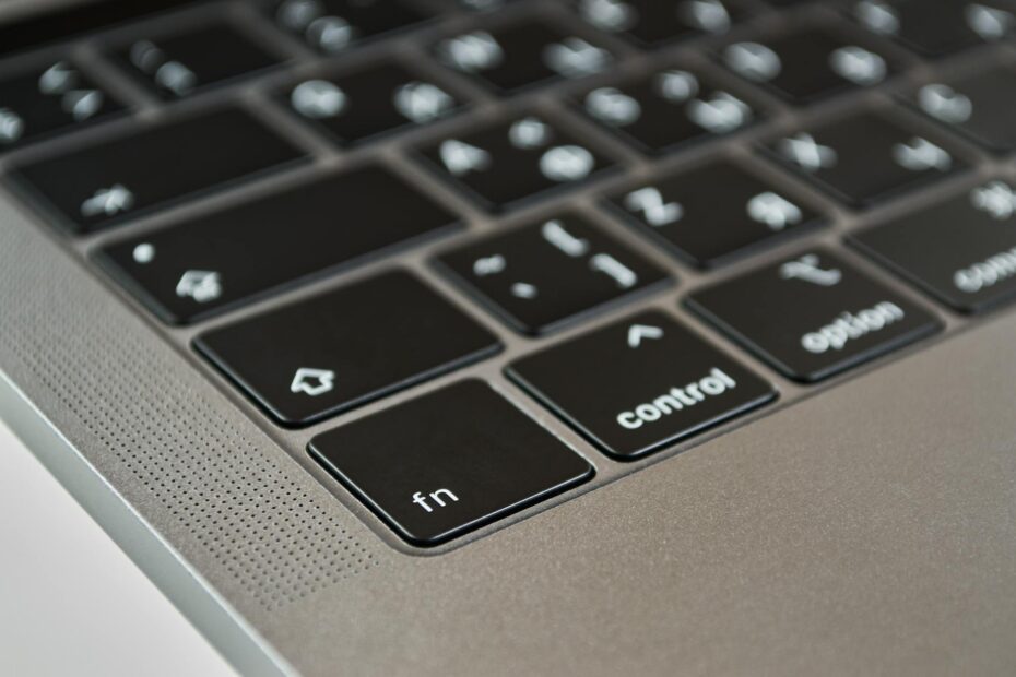 A detailed close-up of a modern laptop keyboard showcasing the fn and control ke