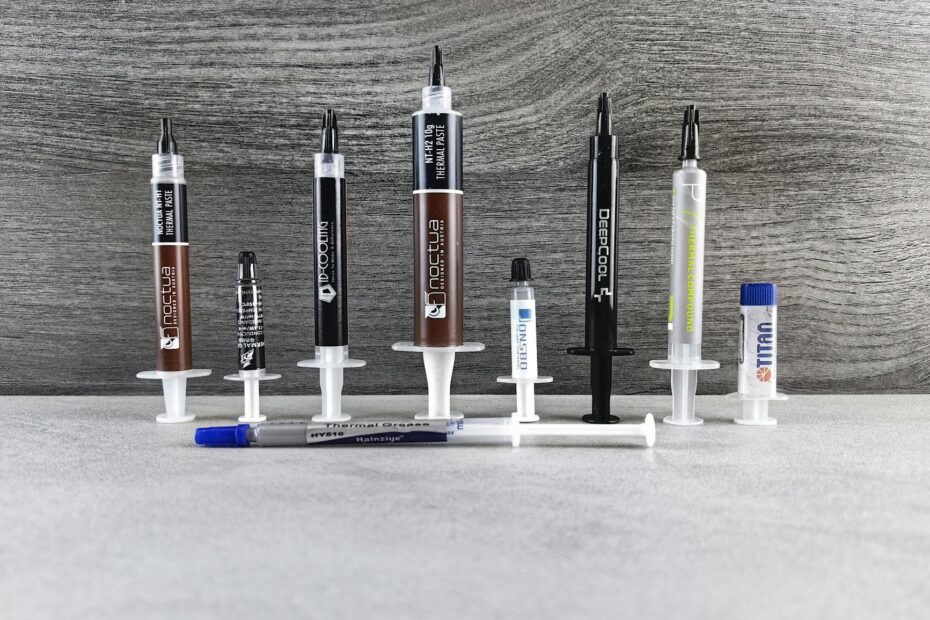 Square computer cooling fans with white blades on a gray background.