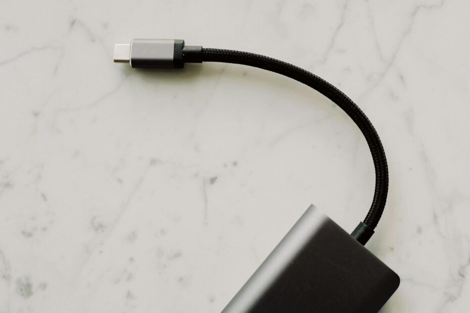 High-quality USB-C cable with connector displayed on elegant marble background for tech enthusiasts.