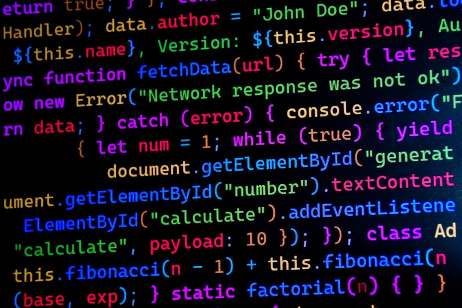 Close-up of colorful JavaScript code displayed on a computer monitor, ideal for tech-themed projects