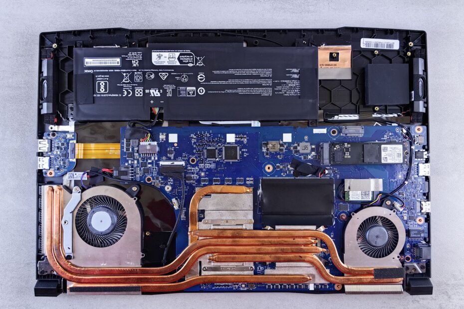 Detailed view of laptop motherboard and cooling system components.